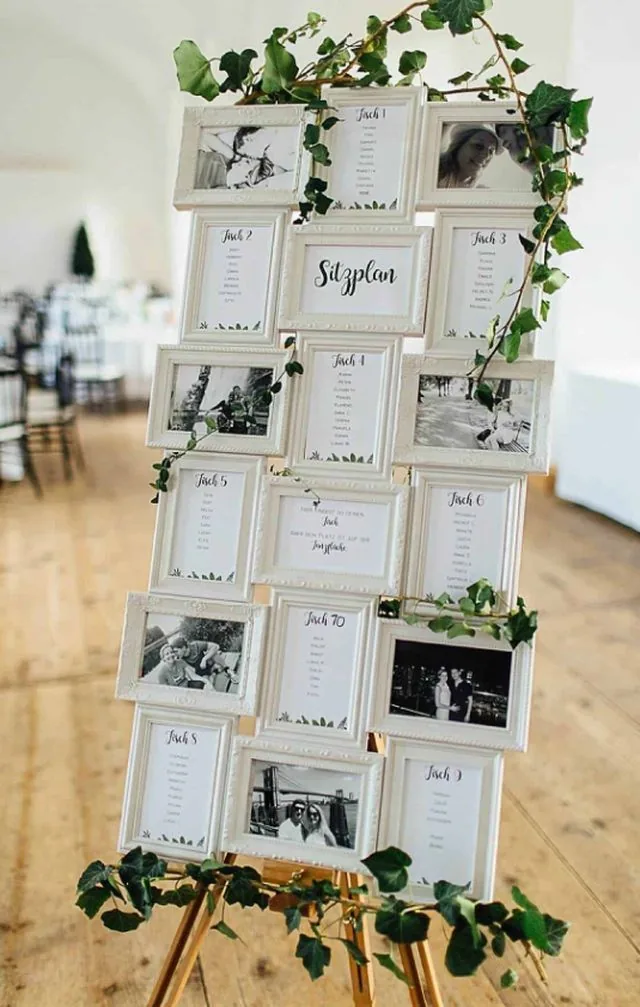 Plan de table : cadres photos blancs et lierre sur chevalet doré
